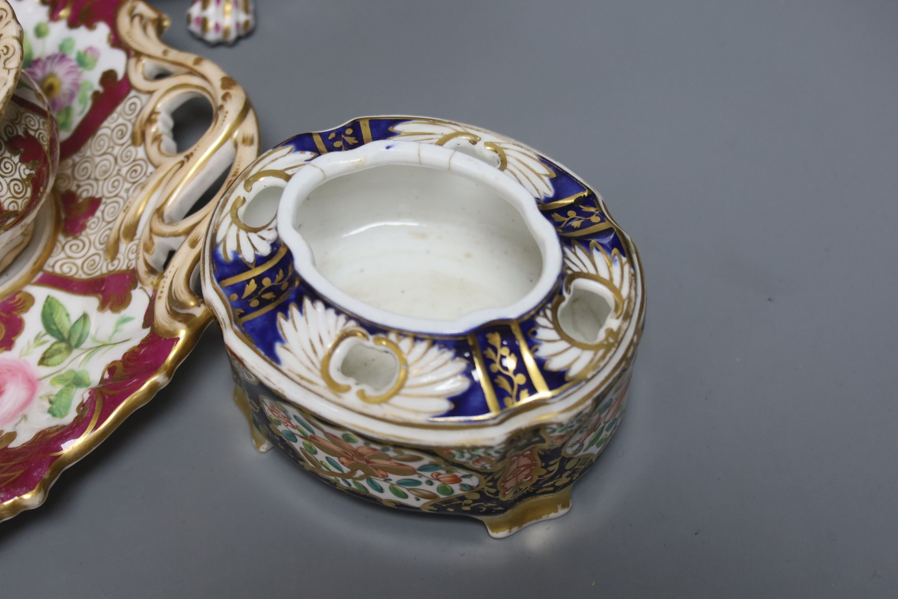 A 19th century English porcelain inkstand, a basket and associated cover and a Spode base, tallest 20cm